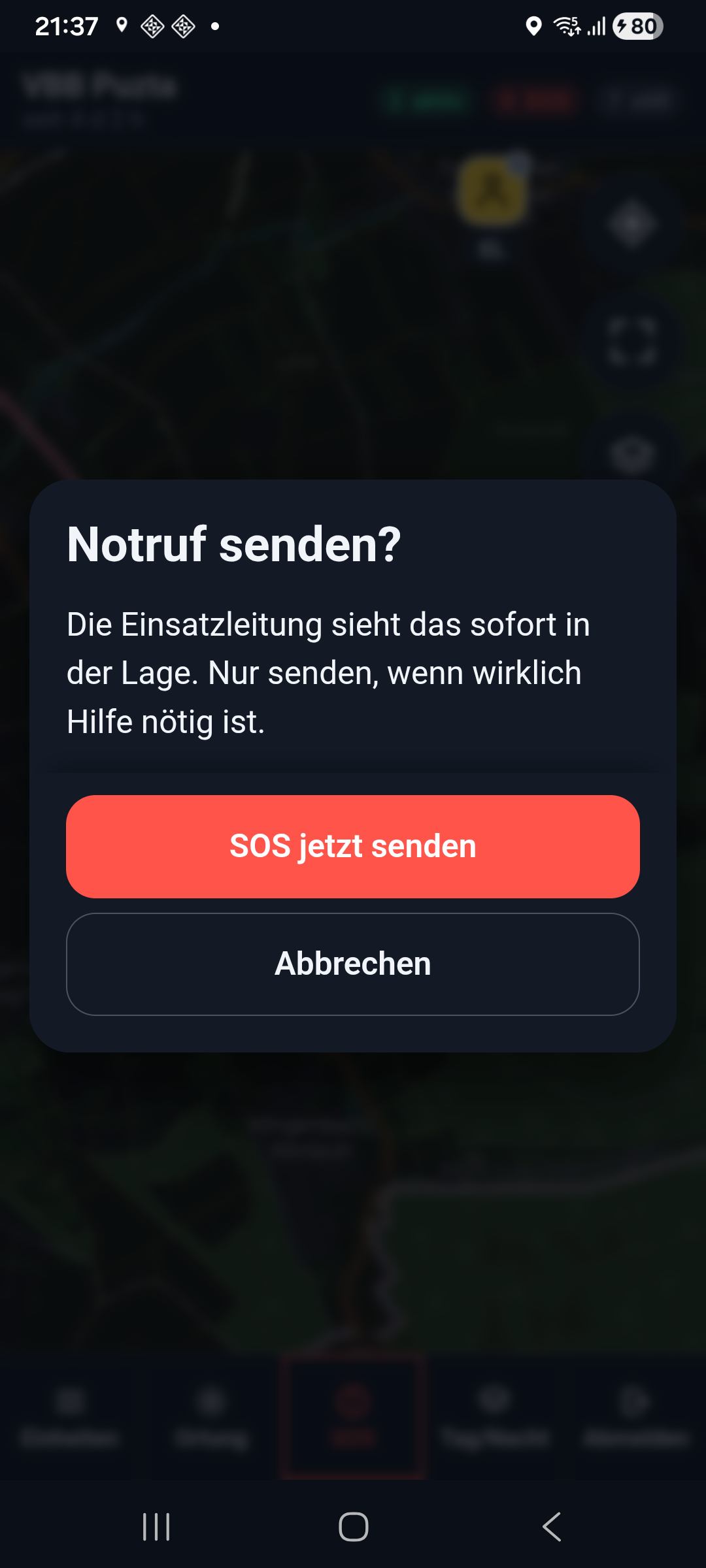 Das Blatt Notruf senden? liegt über dem Bildschirm, darunter die Knöpfe SOS jetzt senden und Abbrechen